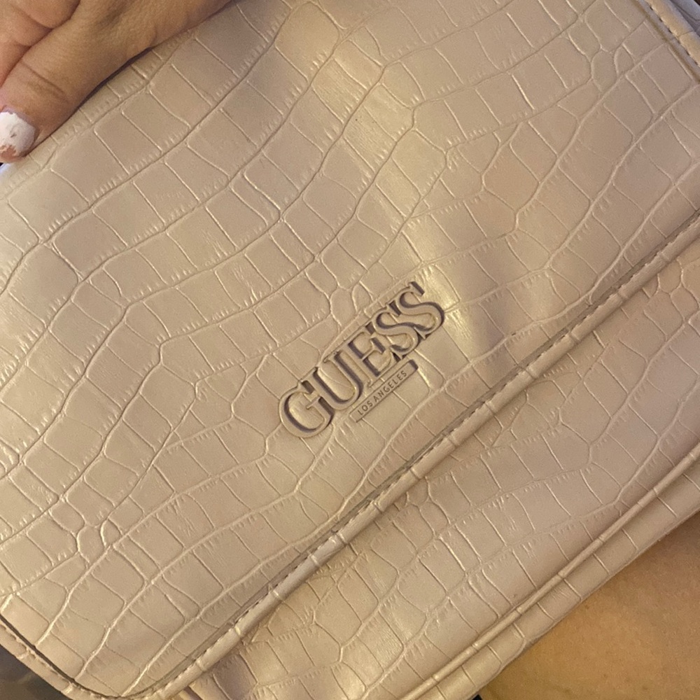 Long hand bag that hangs around the shoulder